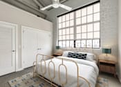 Thumbnail 35 of 43 - A bedroom with a bed, a ceiling fan, and a window with blinds at The Carousel Apartments, Richmond, VA, 23220