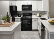 Thumbnail 10 of 19 - Kitchen with White Cabinets at Chapel View Apartments in Chapel Hill, NC