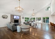 Thumbnail 3 of 19 - a living room with couches and chairs and a fireplace at Chapel View Apartments in Chapel Hill, NC