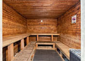 Thumbnail 13 of 31 - an empty sauna with wooden benches at Linkhorn Bay Apartments, Virginia Beach