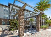 Thumbnail 10 of 29 - Patio with a Pergola and a Table at The Loree, Jacksonville, FL, 32256