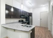 Thumbnail 26 of 39 - Upgraded Kitchen Appliances and Cabinets at District at Medical Center, San Antonio