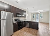 Thumbnail 24 of 39 - Spacious Upgraded Kitchen Appliances and Cabinets at District at Medical Center, San Antonio