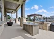 Thumbnail 18 of 25 - BBQ Grill Area Overlook at Stone Oak Park Apartments, San Antonio, 78258