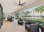 Thumbnail 30 of 35 - Clubhouse Patio Lounge at Park at Rialto Apartments, San Antonio