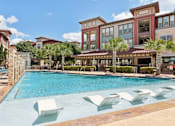 Thumbnail 31 of 35 - Pool and Lounge Chairs at Park at Rialto Apartments, San Antonio