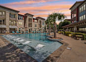 Thumbnail 33 of 35 - Evening Time View of the Pool at Park at Rialto Apartments, San Antonio