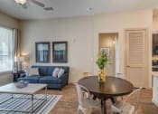 Thumbnail 18 of 31 - Open Floor Plan - Kitchen to Living Room & Access to Patio at District at Medical Center, San Antonio