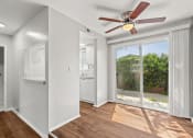Thumbnail 6 of 15 - Living Room View to Outdoor Patio