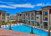 Thumbnail 3 of 35 - View of Property & Resort Style Pool at Park at Rialto Apartments, San Antonio