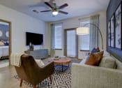 Thumbnail 17 of 35 - MODEL - Living Room/Access to Bedroomarge Balcony at Park at Rialto Apartments, San Antonio