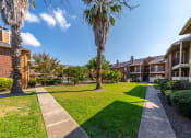 Thumbnail 9 of 11 - Open Courtyard at Oaks of Westlakes Apartments, Texas, 78245