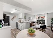 Thumbnail 13 of 22 - A modern kitchen with a dining table