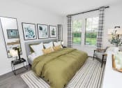 Thumbnail 10 of 46 - a bedroom with a large bed and a large window