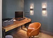 Thumbnail 14 of 48 - a desk with a computer and a chair