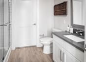 Thumbnail 41 of 48 - a bathroom with a toilet and a shower