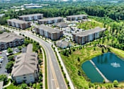 Thumbnail 43 of 48 - an aerial view of a city with buildings and a lake