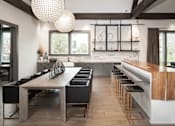Thumbnail 8 of 48 - a clubhouse with a long wooden table and chairs and a kitchen with a bar