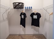 Thumbnail 59 of 60 - Walk-in closet with wire shelving and hanging space at Avli At Crosstown Center Apartments, Florida, 33619