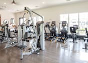 Thumbnail 36 of 60 - Fitness with cardio machines and cable system at Avli At Crosstown Center Apartments, TAMPA