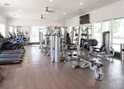 Thumbnail 42 of 60 - Fitness with cardio and weight training machines at Avli At Crosstown Center Apartments, Florida