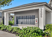 Thumbnail 40 of 60 - Mail with package lockers and address sign at Avli At Crosstown Center Apartments, TAMPA
