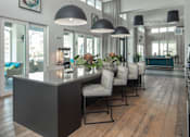 Thumbnail 46 of 60 - Clubhouse cafe with espresso machine and pendant lighting at Avli At Crosstown Center Apartments, Florida