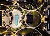 Thumbnail 16 of 60 - Aerial view of resort pool and courtyard amenities at Avli At Crosstown Center Apartments, TAMPA, Florida