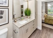 Thumbnail 11 of 46 - bathroom with vanity and view of bedroom