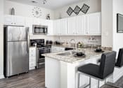 Thumbnail 3 of 31 - Modern Kitchen at Manchester Place Apartments, Lithia Springs, GA
