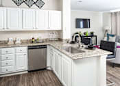 Thumbnail 5 of 31 - Kitchen with cabinets at Manchester Place Apartments, Lithia Springs, 30122