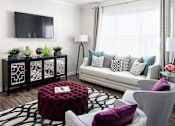 Thumbnail 8 of 31 - Living Room with Couch at Manchester Place Apartments, Georgia, 30122