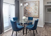 Thumbnail 11 of 31 - Dining Room with Table and Chairs at Manchester Place Apartments, Lithia Springs