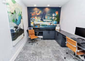 Thumbnail 26 of 46 - an office with a large painting on the wall