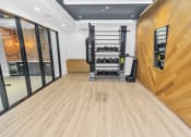Thumbnail 37 of 46 - gym with hardwood floors and white walls