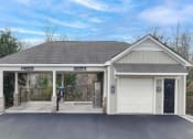 Thumbnail 52 of 54 - carwash and the front of a garage with a driveway and a white door
