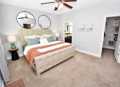 Thumbnail 9 of 54 - a bedroom with a bed and a ceiling fan