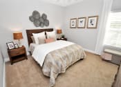 Thumbnail 44 of 54 - Riverstone Model Bedroom with bed and nightstands