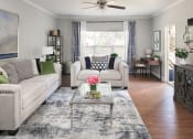 Thumbnail 3 of 54 - a living room with couches and a coffee table