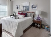 Thumbnail 73 of 78 - a bedroom with a bed with white sheets and pillows