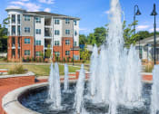 Thumbnail 14 of 78 - Lush Pointe at Prosperity Village Courtyards With Trickling Fountains in North Carolina Apartments for Rent