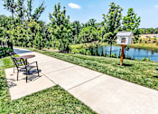 Thumbnail 31 of 48 - a patio with a table and chairs