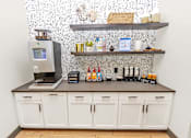 Thumbnail 29 of 48 - a coffee bar with a coffee machine and a coffeemaker on a counter