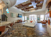 Thumbnail 12 of 30 - a large clubhouse with a couch and a table