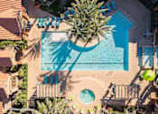 Thumbnail 26 of 30 - an aerial view of a swimming pool with palm trees