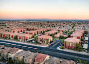 Thumbnail 27 of 30 - an aerial view of a city with houses and an intersection