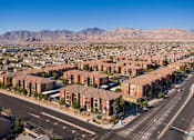 Thumbnail 28 of 30 - an aerial view of a city with mountains