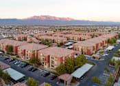 Thumbnail 29 of 30 - an aerial view of a city with mountains in the background