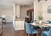 Thumbnail 5 of 30 - a dining room and kitchen with a table and chairs