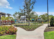 Thumbnail 15 of 32 - walkway with trees and plants at the central apartments near downtown minneapolis mn 55408